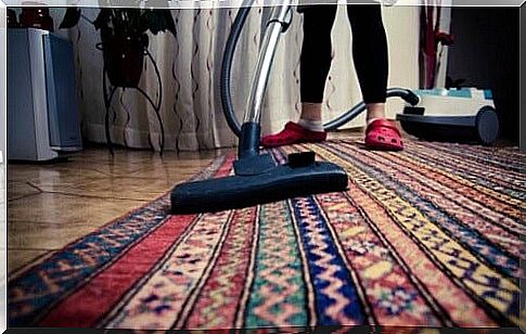 Vacuuming the carpet 