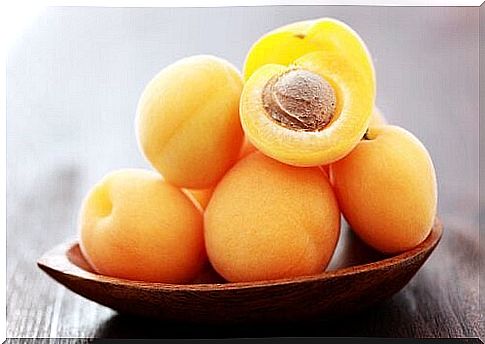 Apricots on a bowl.