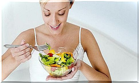 woman eating salad