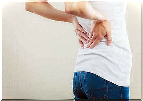 Woman With Back Pain - How To Reduce Lower Back Pain?