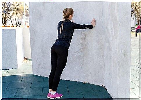 Leaning against a wall is a great way to pre-practice your push-ups.