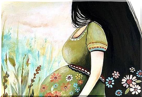 Pregnant woman on a background of flowers