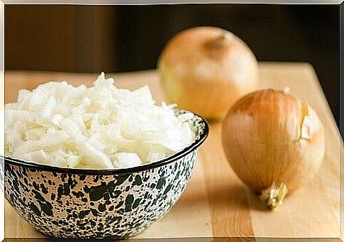 A bowl of chopped onions and whole