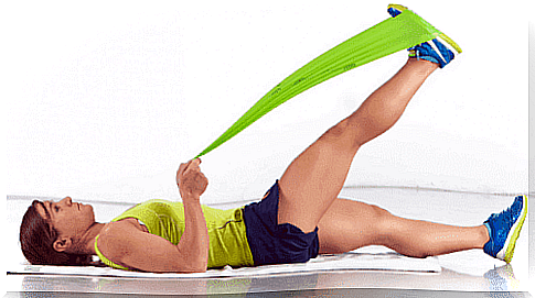 Woman exercising with tape