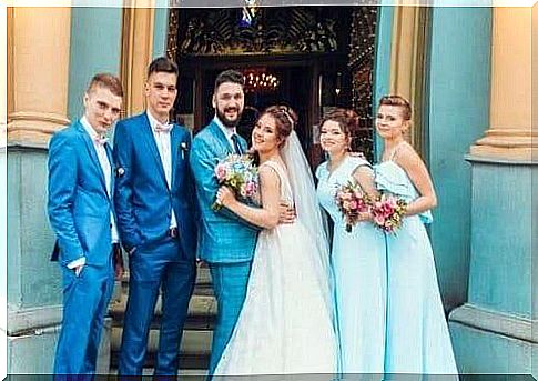 In front of the church - the wedding mother, the bride and groom and witnesses